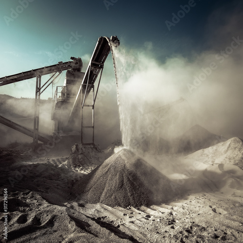 Industrial background with working gravel crusher
