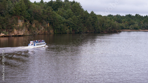Cruising the scenic river, boat tour. Landscape, summertime, cloudy day. Wisconsin river, Wisconsin Dells.
