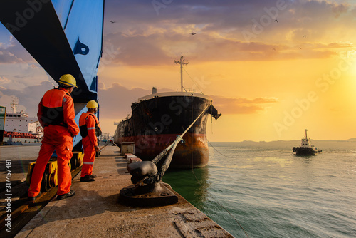 mooring man in charge of safety sailing of the ship leaving from the port