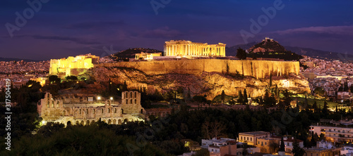 Panorama of Athens with Acropolis hill at dramatic sunset.