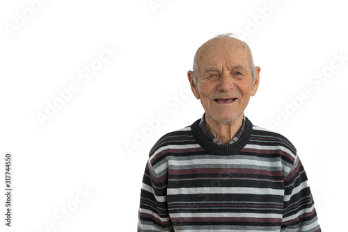 Close up portrait of an old male, man in casual clothes, senior smiles and shows his mouth without teeth, isolated over white background, copyspace for your text