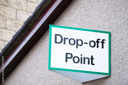 Drop off point sign for charity shop donation and recycle yard for goods toys food bank and clothes for welfare and the poor