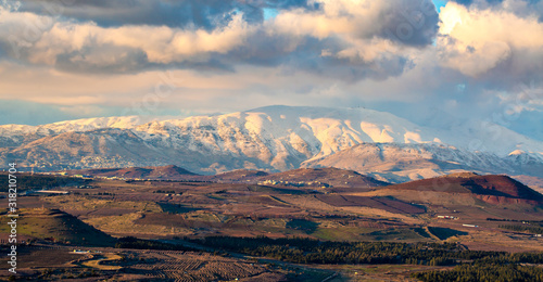 Snow on Hermon mountain with blue sky and clouds landscape view