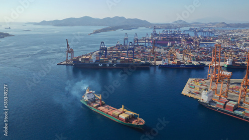 Aerial photo of industrial cargo container terminal in Perama and Drapetsona commercial port near Piraeus, Attica, Greece