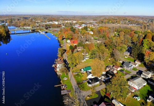 The aerial view of the waterfront homes by Oneida Lake with stunning fall foliage near Syracuse, New York, U.S.A