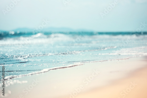 Close-up soft wave of the sea on the sandy beach