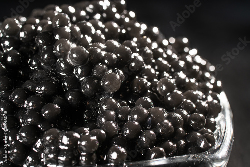 Black Caviar background. High quality real natural sturgeon black caviar close-up.