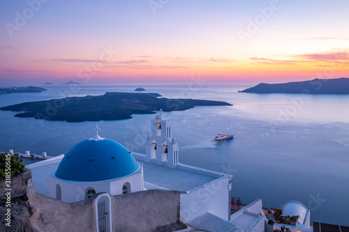 Picturesque summer sunset on the famous travel destination in Santorini, summer vacation background. Fantastic white architecture, inspirational sunset view 
