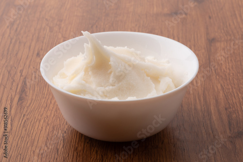 small bowl of lard on wooden table