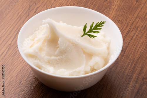 small bowl of lard on wooden table