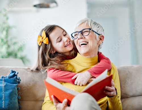 grandchild granddaughter grandma grandmother reading book girl senior