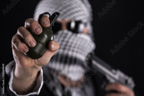 terrorist with a grenade in his hand