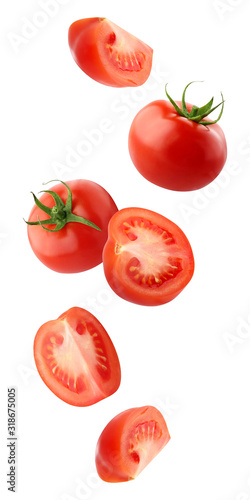 falling tomatoes isolated on a white background with a clipping path.