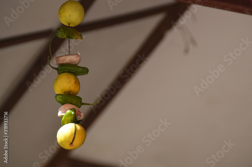 Lemon and chillies hanged in houses in Nepal and India as good luck charm and protection against the evil eye