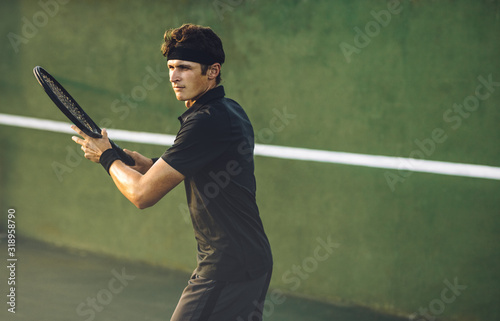 Player hitting a forehand on tennis court