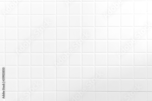 White tiles wall texture for the decoration of the cafe.
