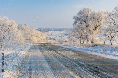 Winter landscape with country slippery road near Solone village in central Ukraine