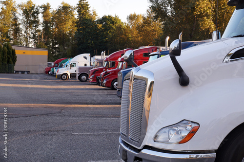 Truck stop. A row of trucks during a stopover, travel breaks.