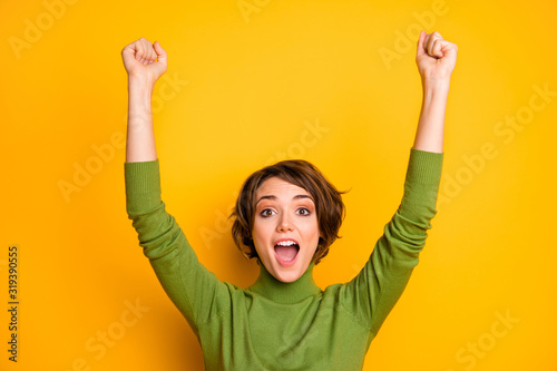 Close up photo of crazy funky sports fan girl celebrate football team victory raise fists scream yeah wear good look outfit isolated over vivid color background