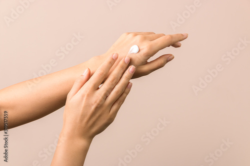 skincare. close up view of woman hand moisturising them with cream. skincare