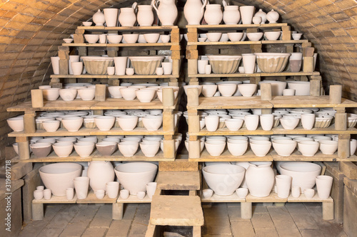 Ceramic kiln with unkilned earthenware