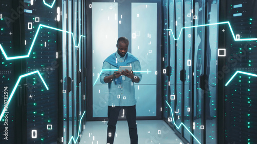 Digitalization of Information. Black Young Server Administrator with Digital Tablet Working in High Tech Data Center. 3D Looped Animation of Data Flow with Graphic Elements, Glowing Board Lines, and