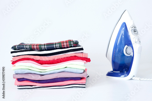 a pile of colorful clothes on white background