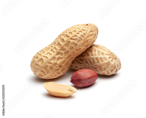 Dried peanuts in peel closeup isolated on white background