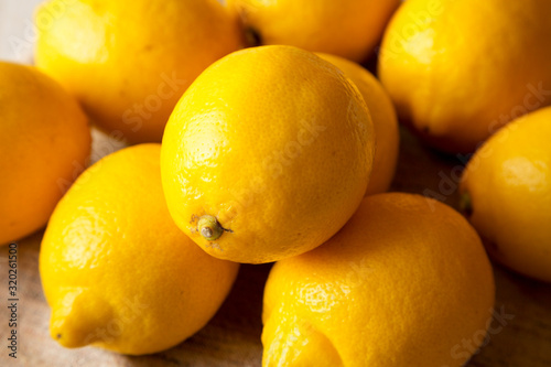 Ripe Yellow Organic Lemons on cloth, side view. Close-up.