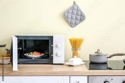 Modern microwave oven in kitchen