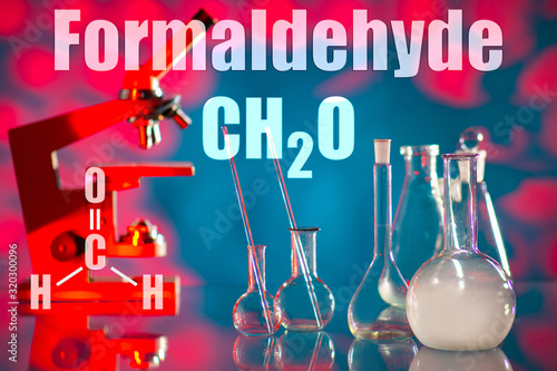 A scientist conducts an experiment in chemistry. Chemical test Chemical laboratory. Scientific research. A man in a white coat. A man with a pipette takes samples.