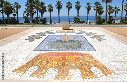 Civitavecchia, Italy. Colorful pedestrian pavement along beach front . Civitavecchia is a sea port located 80 kilometres west-north-west of Rome.