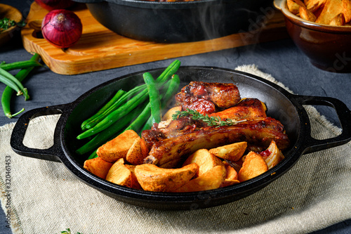 Rib of pork with beans and quarter potato