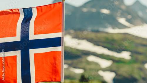 Norwegian flag and mountains snowy landscape