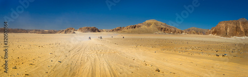 Safari tour on quads at the stone desert in Egypt.