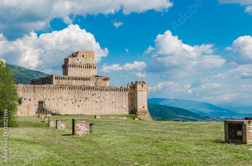 A view of the ancient Rocca Maggiore castle in the religious pilgrimage city of Assisi in Italy on a sunny day