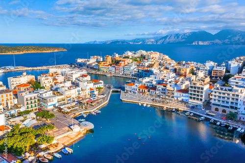 The lake Voulismeni in Agios Nikolaos, a picturesque coastal town with colorful buildings around the port in the eastern part of the island Crete, Greece