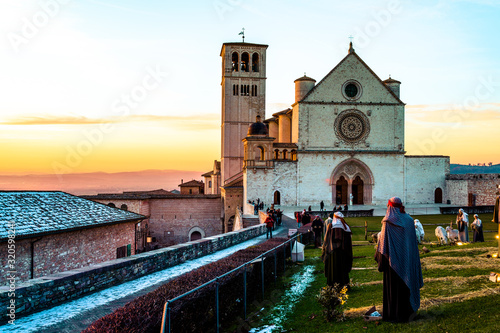 winter sunset at the Saint Francis church in assisi (italy)