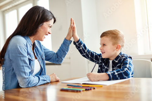 homework teaching boy high five education mother children son familiy childhood