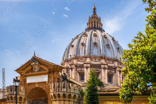 Rome, Vatican, Italy - Panoramic view of St. Peter’s Basilica main dome by Michelangelo Buonarotti with the Fountain of the Sacrament seen from the Vatican Gardens