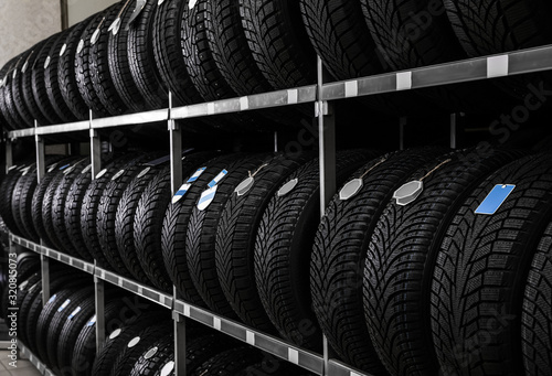 Car tires on rack in auto store