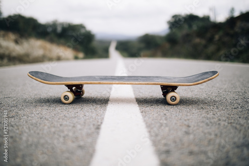 wooden skateboard on the road