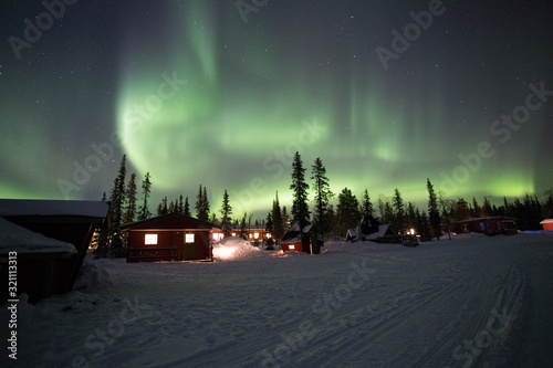 Northern Lights dancing over the sky at camp Alta, Kiruna, Lapland, Sweden. The most amazing phenomena on earth.