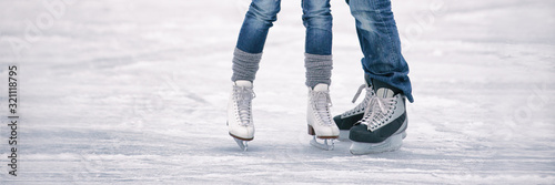 Ice skating outoor rink panoramic banner of people tourists skates learning to skate romantic couple winter activity panorama.