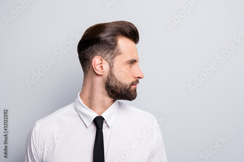 Closeup profile photo of attractive handsome business man looking empty space showing perfect neat beard wear white office shirt tie isolated grey color background