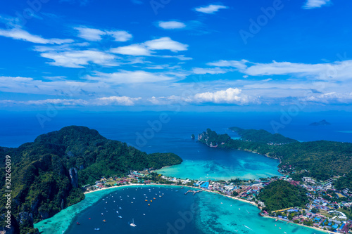 Beautiful panoramic view over Tonsai and Dalum Beach. Green jungles and hot stones on the bright sun of tropical island and the mountains in Andaman Sea. Phi Phi Viewpoint, Krabi, Thailand