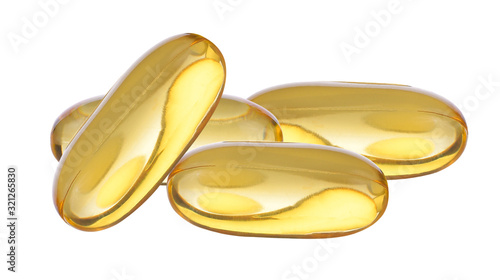 Close up of food supplement oil filled capsules suitable for: fish oil; omega 3; omega 6; omega 9; evening primrose; borage oil; flax seeds oil; vitamin A; vitamin D; vitamin D3; vitamin E