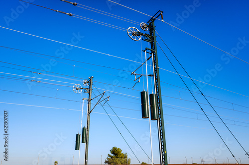 Towers of the electrified catenaries of a high-speed train in Spain.