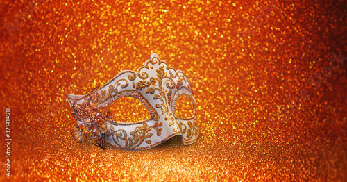 Carnival mask from Venice on golden background