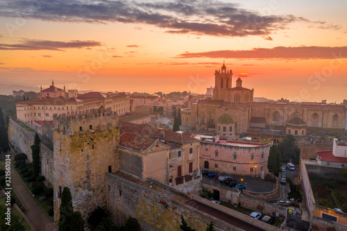 Aerial sunrise view of the medieval walled center of Tarragona in Catalunya Spain with the cathedral, city walls, bastions and towers